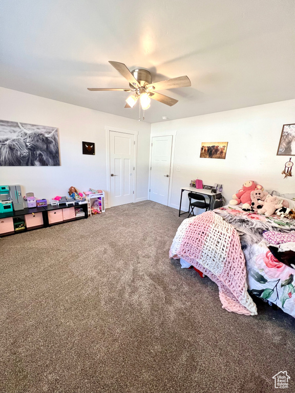 Bedroom featuring carpet flooring and a ceiling fan