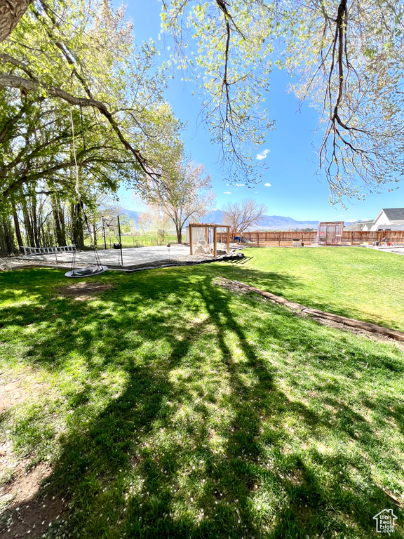 View of yard with fence