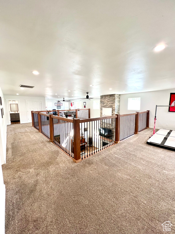 Additional living space with ceiling fan, carpet flooring, and recessed lighting