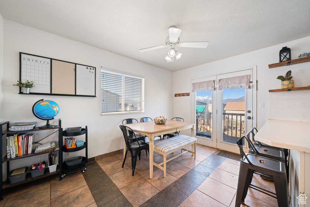 Dining area featuring baseboards and ceiling fan