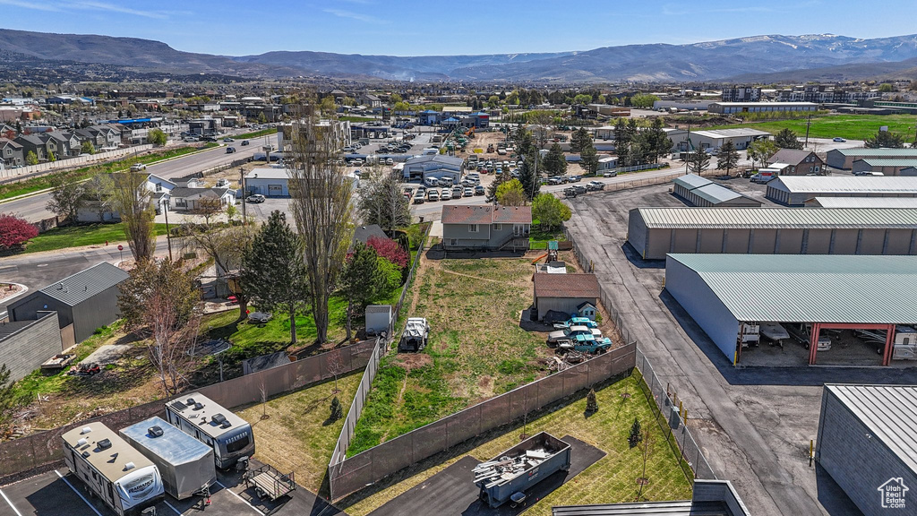 Drone / aerial view with a residential view and a mountain view