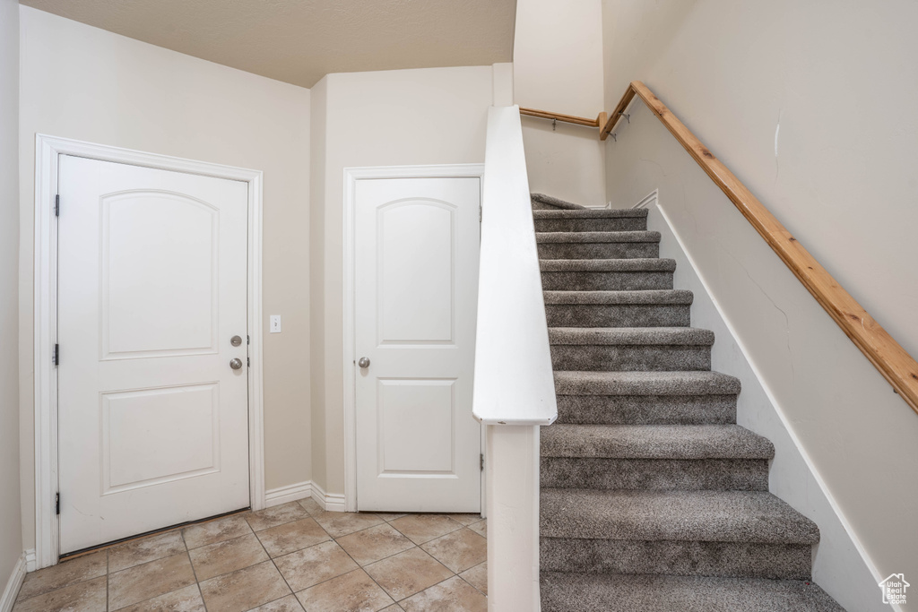 Stairway featuring baseboards