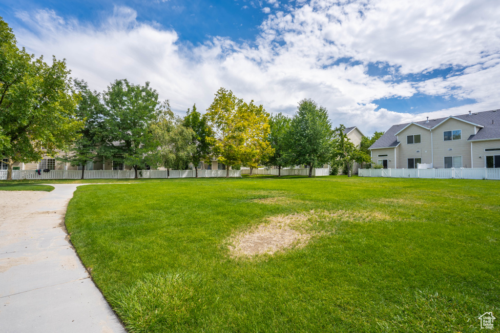 View of yard with fence and a residential view