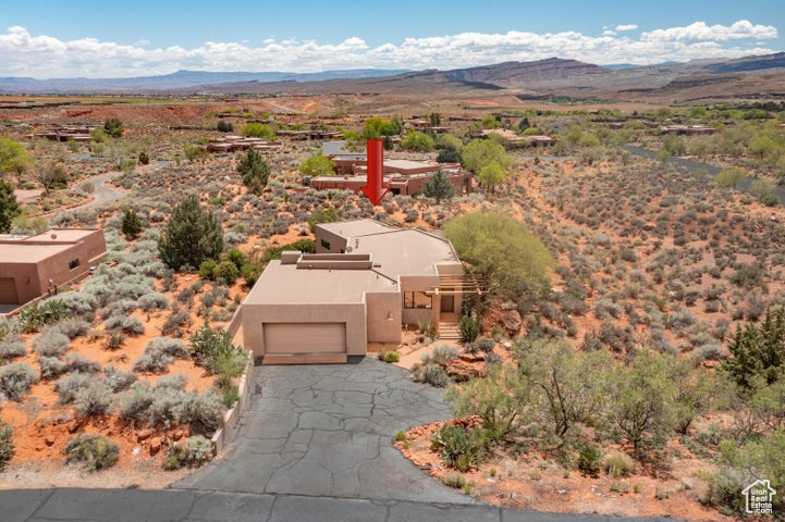 Birds eye view of property with a mountain view