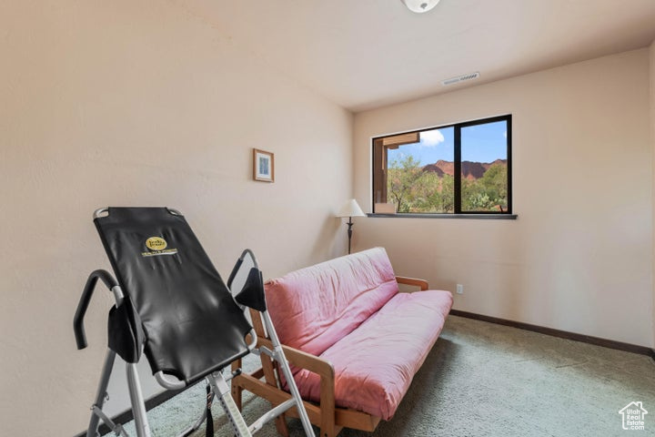Sitting room featuring baseboards, visible vents, and carpet floors