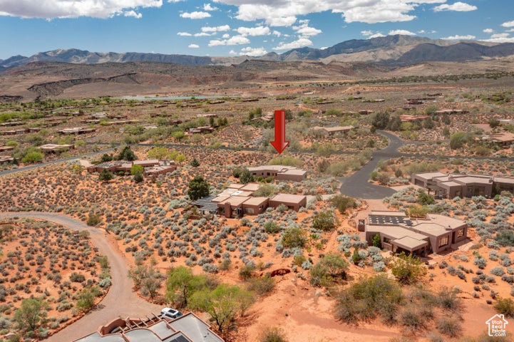 Birds eye view of property featuring a rural view, view of desert, and a mountain view