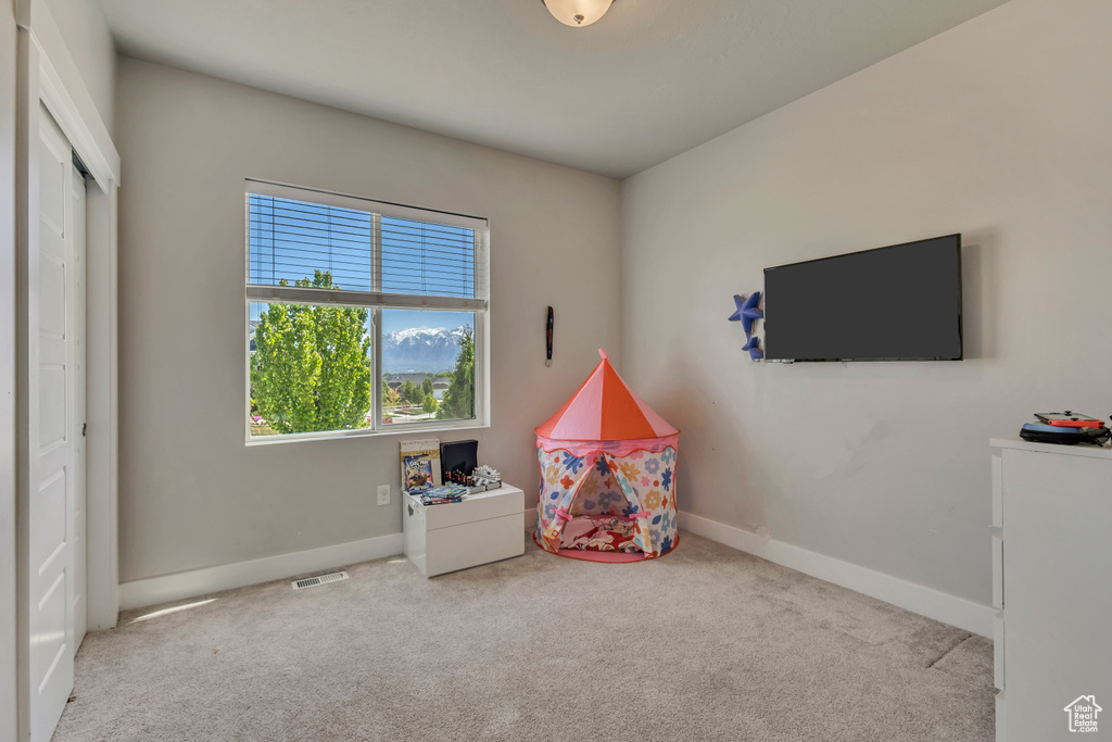 Playroom with visible vents, baseboards, and carpet floors