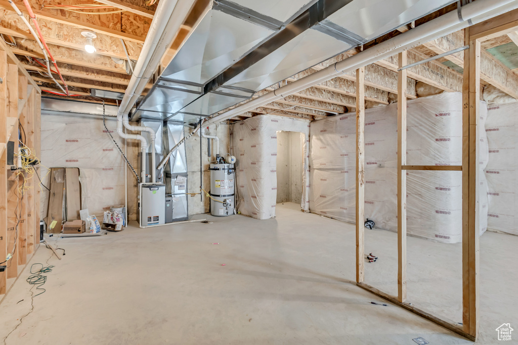 Unfinished below grade area with secured water heater and heating unit