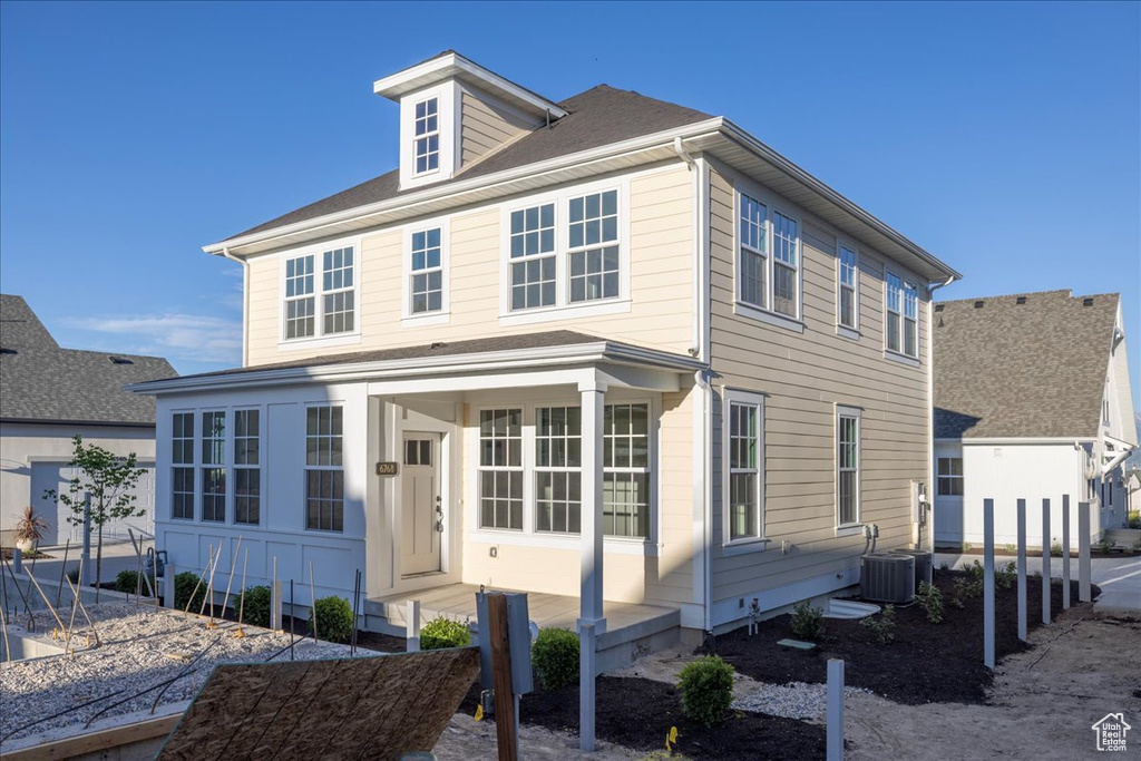 View of front of house with cooling unit