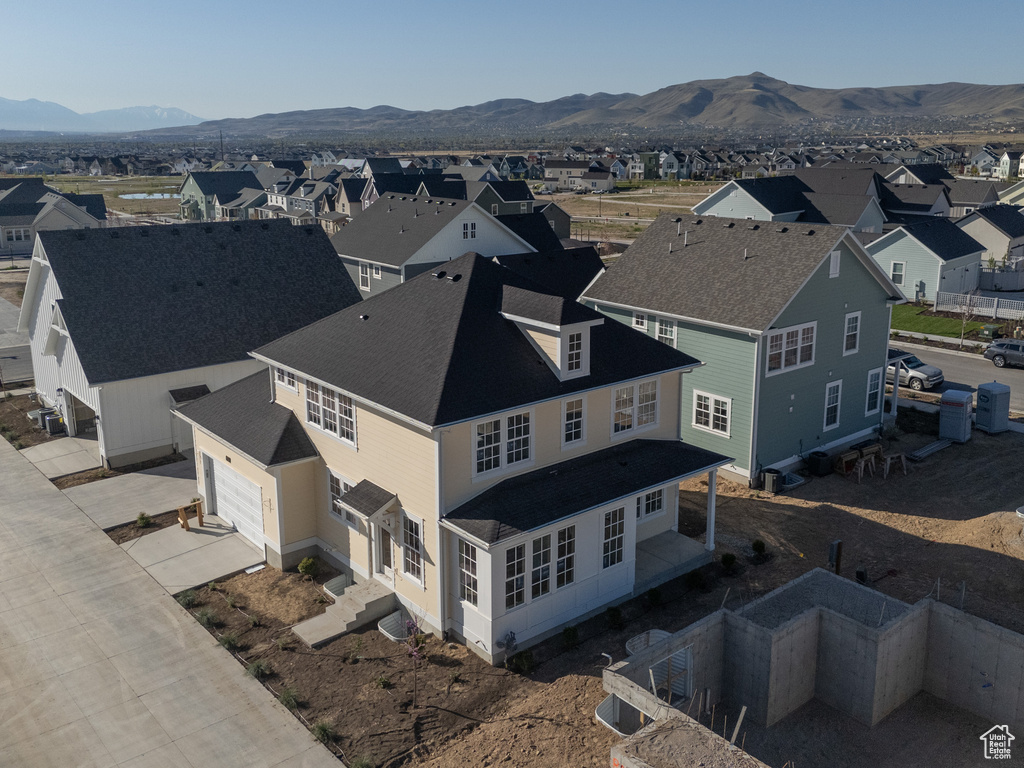 Drone / aerial view with a mountain view and a residential view