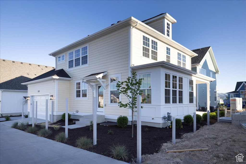 View of front of property featuring a garage