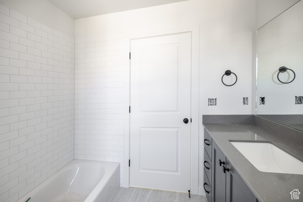 Bathroom with vanity and shower / bathtub combination
