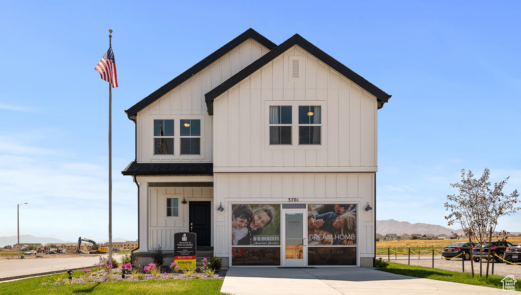 Modern farmhouse featuring a mountain view and board and batten siding