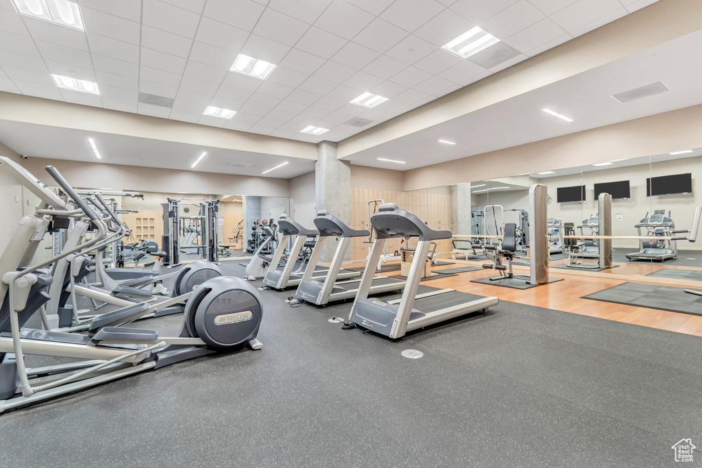 Gym with a paneled ceiling