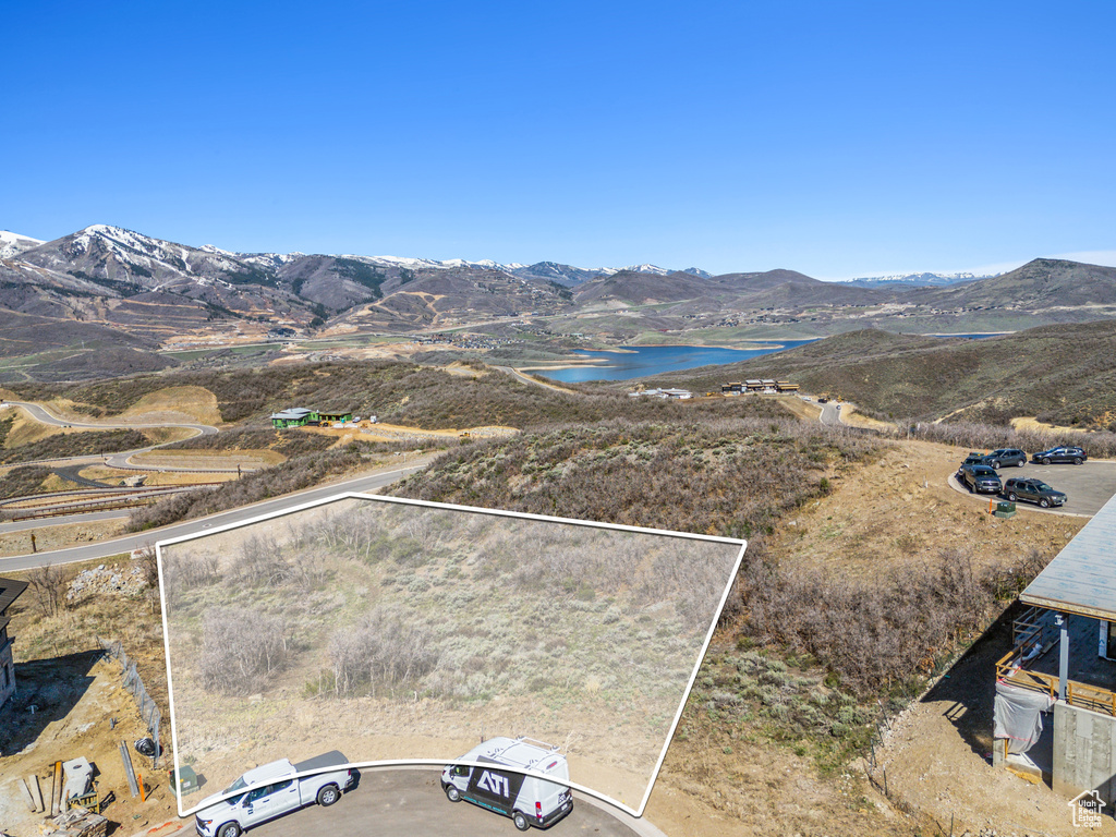 Property view of mountains featuring a water view