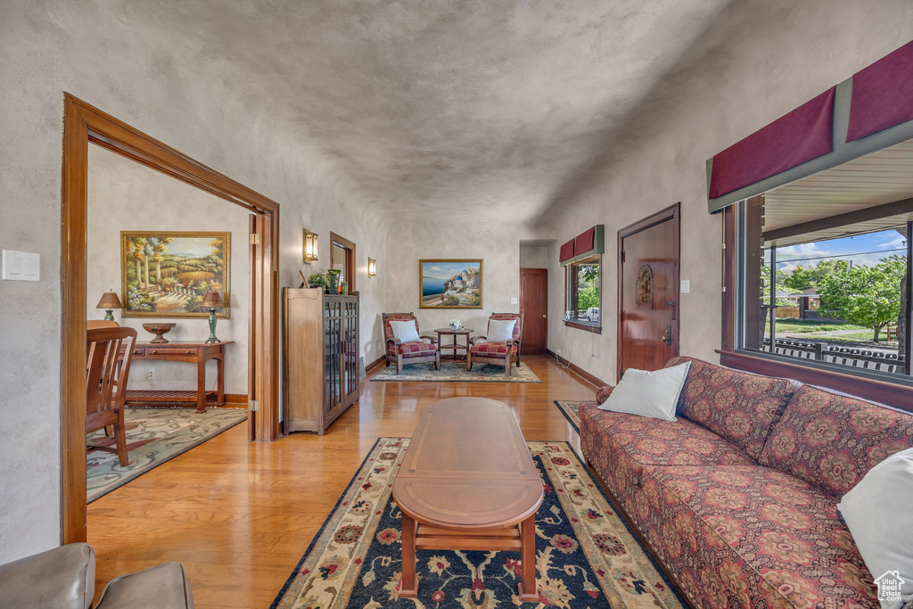 Living room with light wood finished floors and baseboards