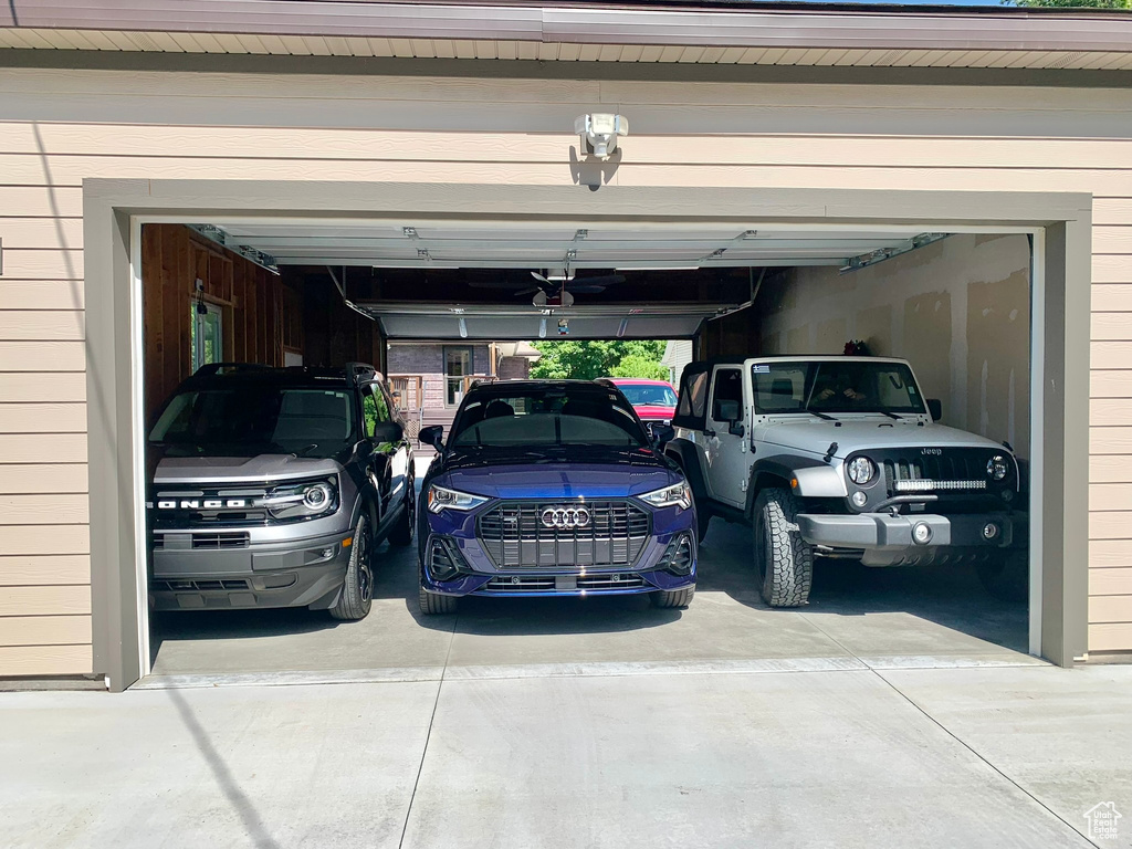 Garage featuring driveway
