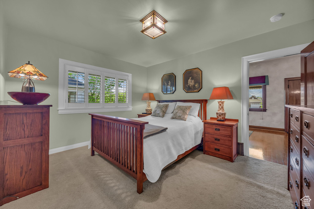 Carpeted bedroom featuring baseboards