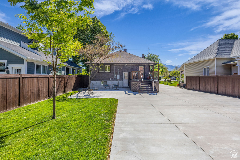 Rear view of property with a patio area