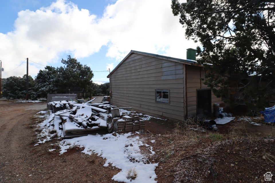 View of snow covered property