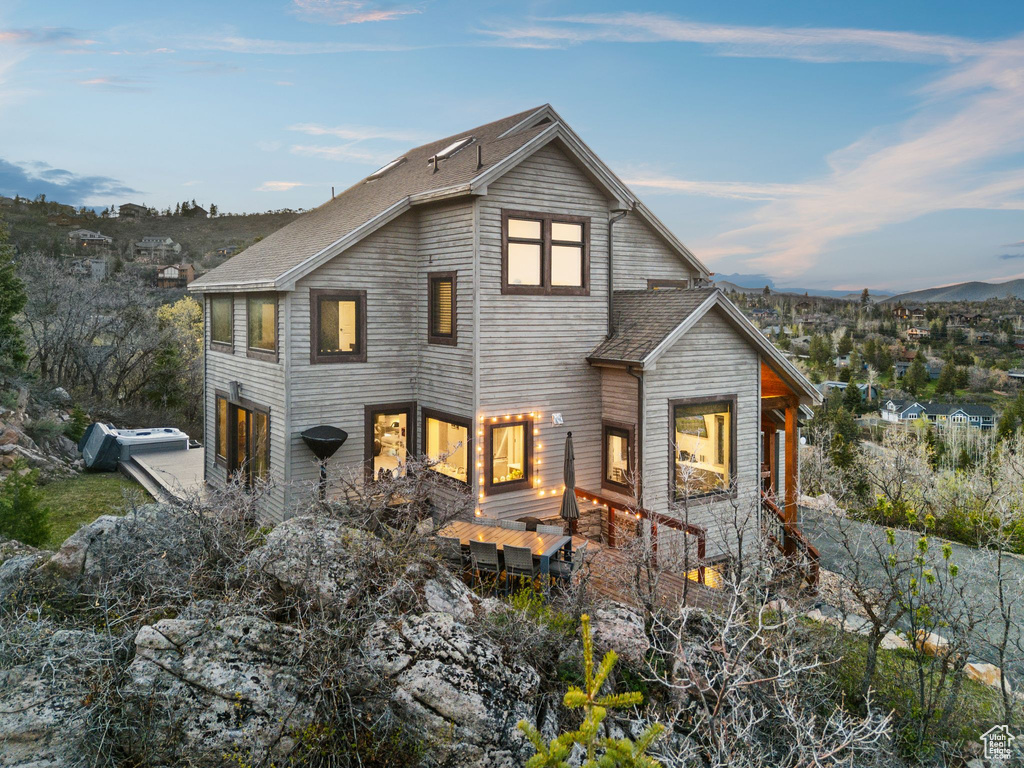 View of front of house featuring roof with shingles