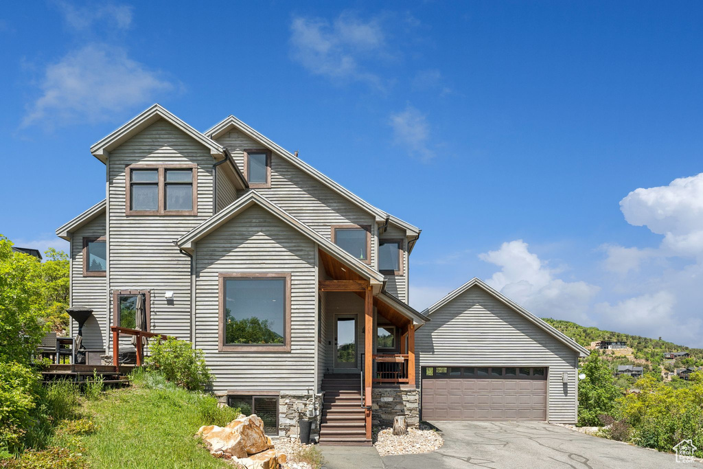 View of front of house with a garage and driveway
