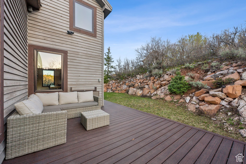 Wooden terrace with an outdoor living space