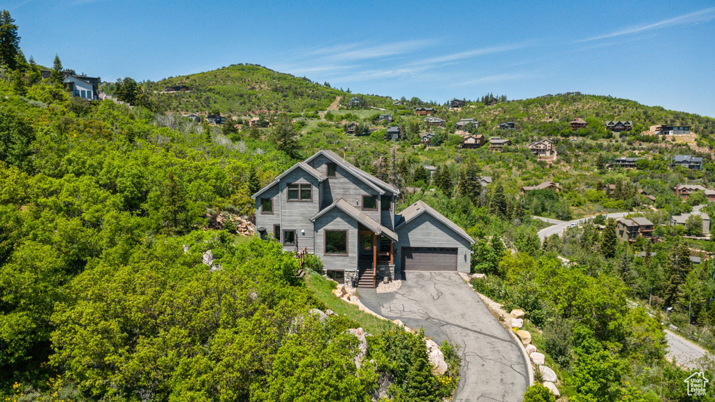 View of front facade with a mountain view and a detached garage