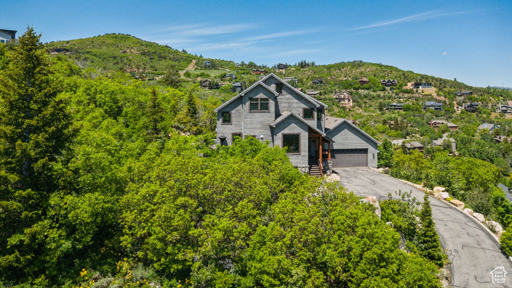Chalet / cabin featuring a mountain view and a chimney