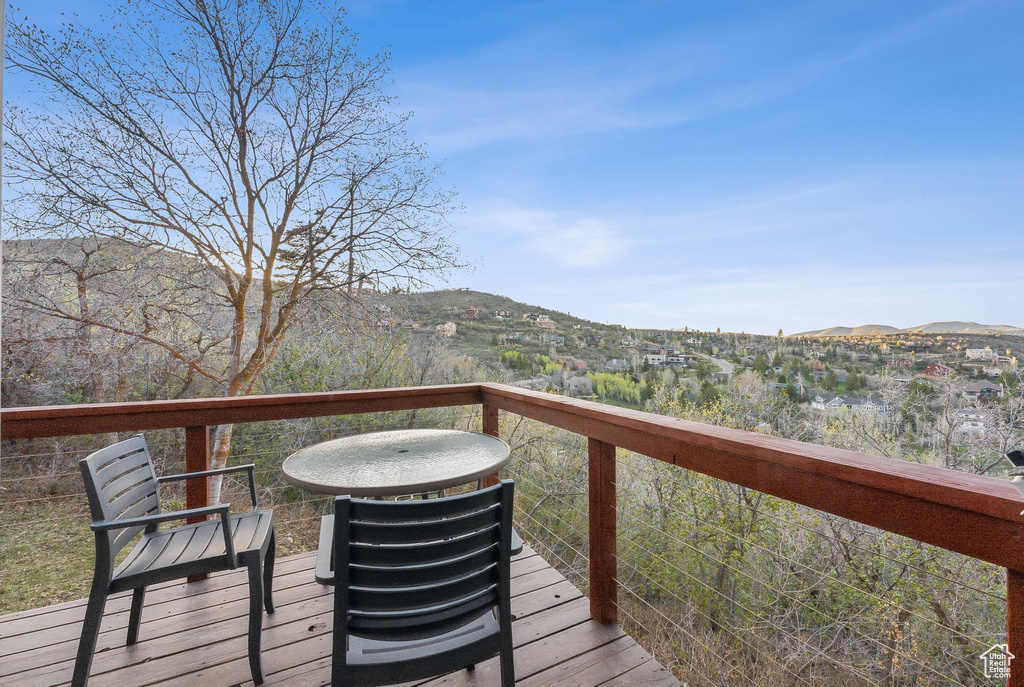 Wooden terrace featuring a mountain view
