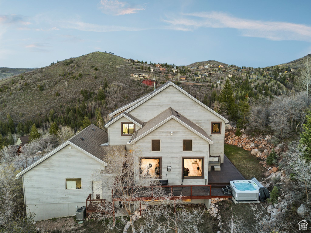 Exterior space featuring a deck with mountain view