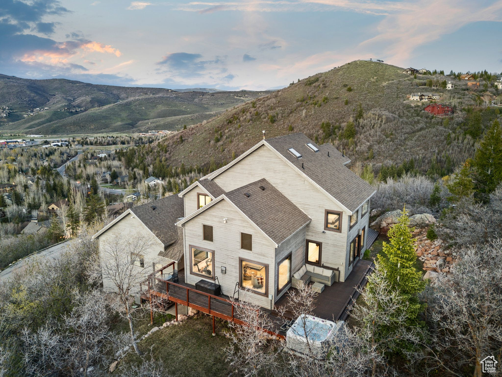 Birds eye view of property with a mountain view
