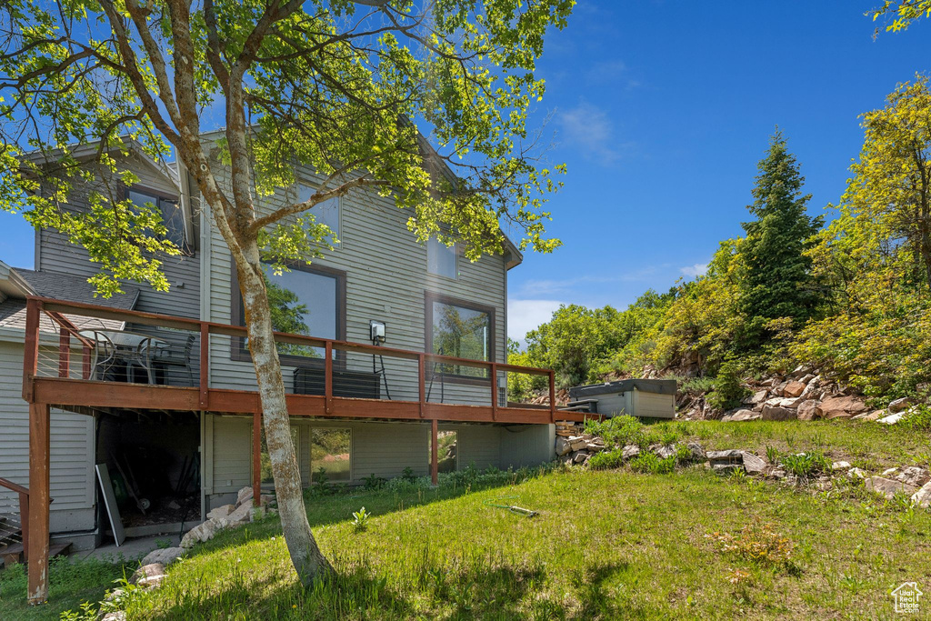 Rear view of property with a wooden deck
