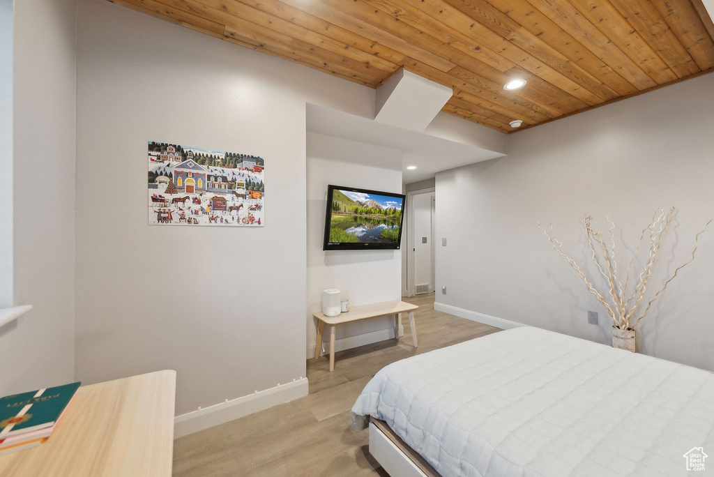 Bedroom featuring wood ceiling, light wood-style flooring, baseboards, and recessed lighting