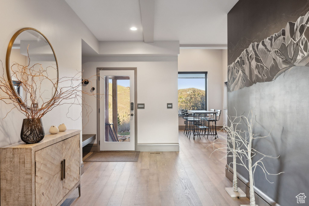 Entrance foyer with baseboards, recessed lighting, and hardwood / wood-style flooring