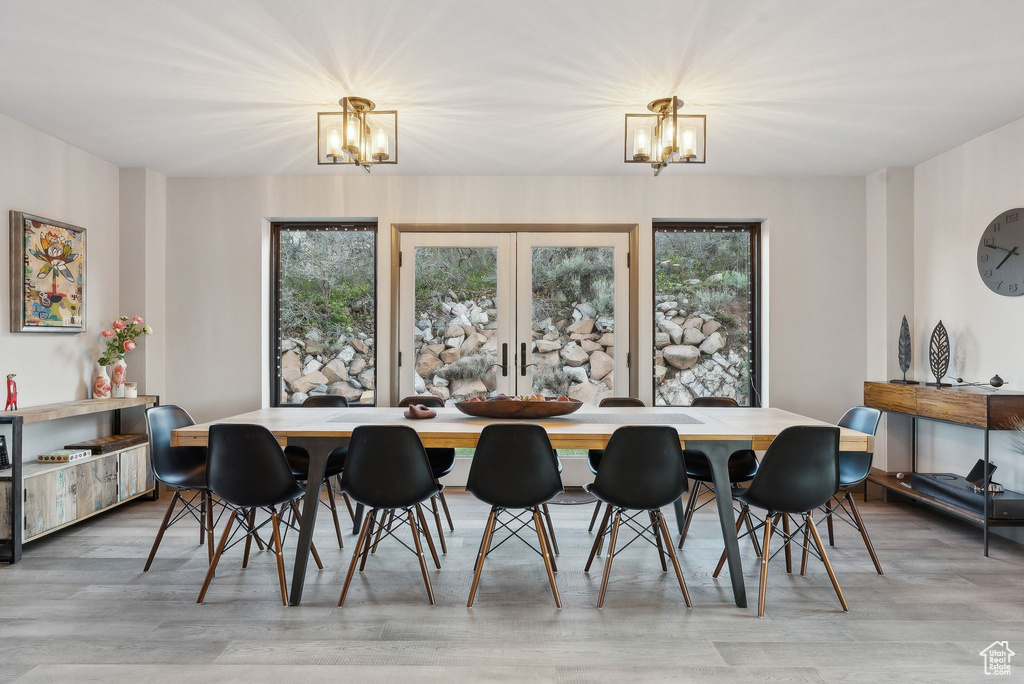 Dining space featuring an inviting chandelier and light wood-style floors