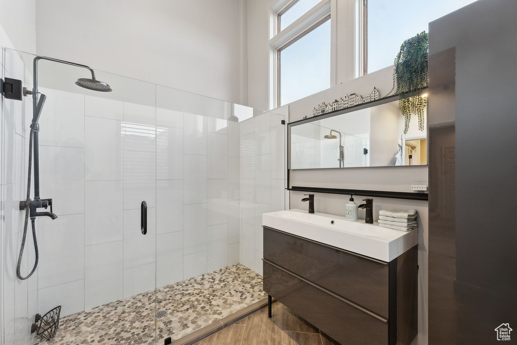 Full bathroom with a stall shower and vanity
