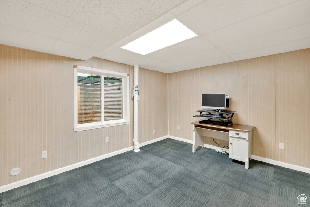 Home office with baseboards, a drop ceiling, and dark carpet