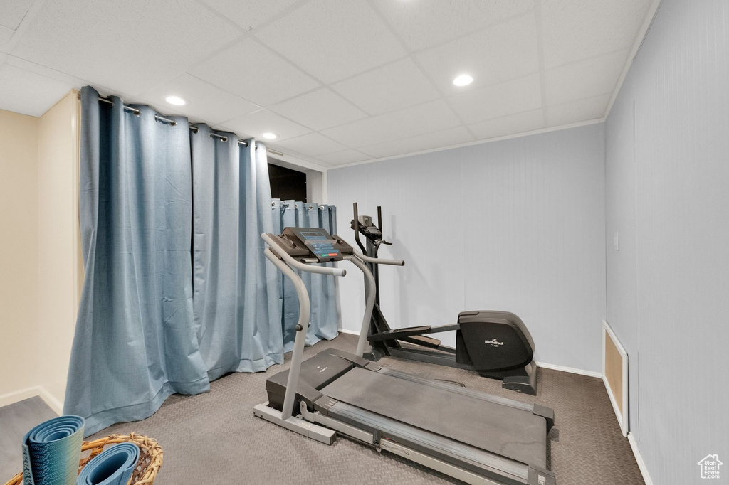 Exercise area with baseboards, recessed lighting, and carpet floors