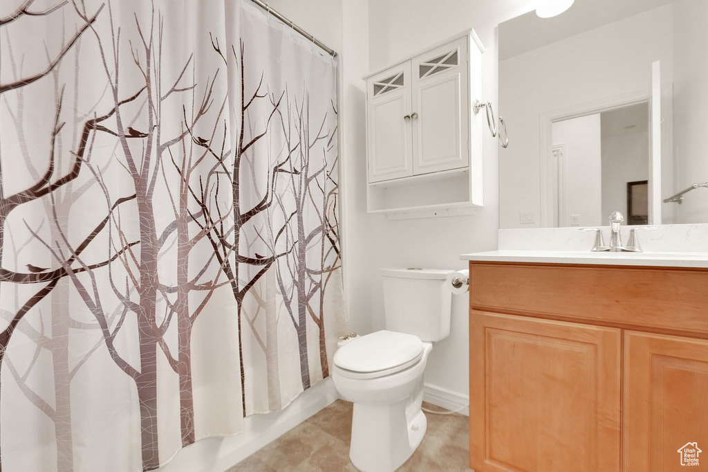 Full bathroom featuring vanity and toilet