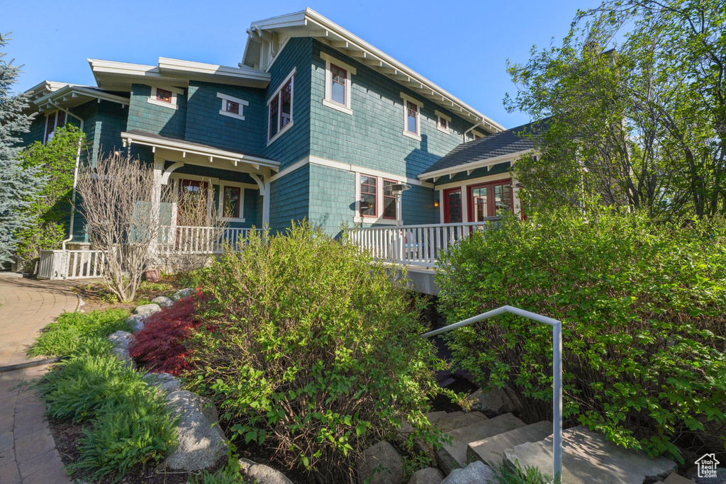 Rear view of property with a porch