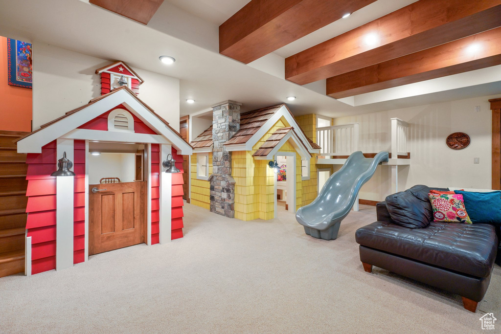 Recreation room with recessed lighting, beam ceiling, decorative columns, and carpet