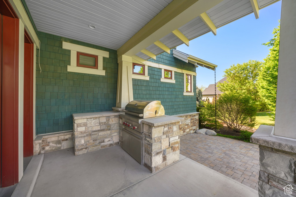 View of patio with area for grilling and grilling area