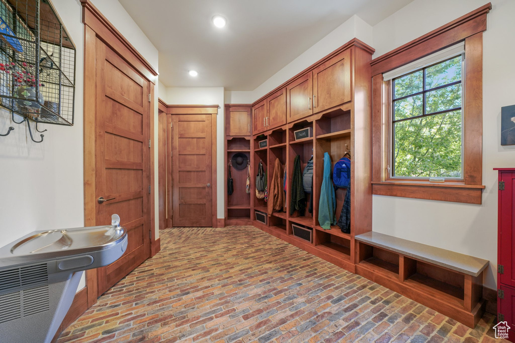 Mudroom featuring brick floors and recessed lighting