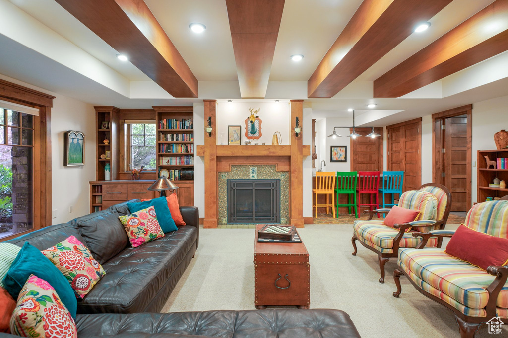 Living room with recessed lighting and a fireplace with flush hearth