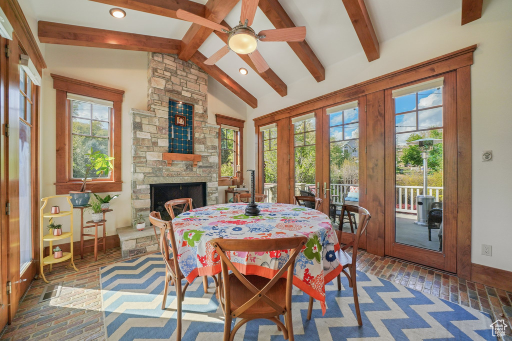 Dining space featuring brick floors, healthy amount of natural light, a ceiling fan, and recessed lighting