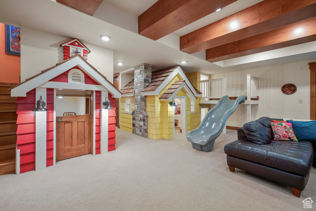 Rec room with carpet, decorative columns, recessed lighting, and beamed ceiling