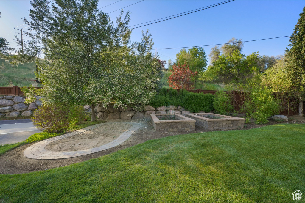 View of yard featuring fence