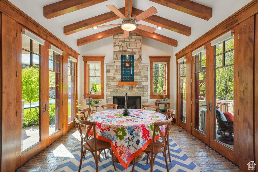 Sunroom featuring french doors and beam ceiling