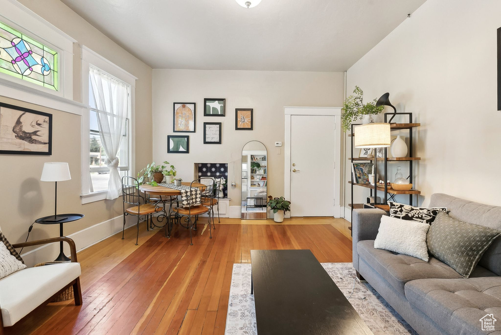 Living area featuring baseboards and hardwood / wood-style flooring